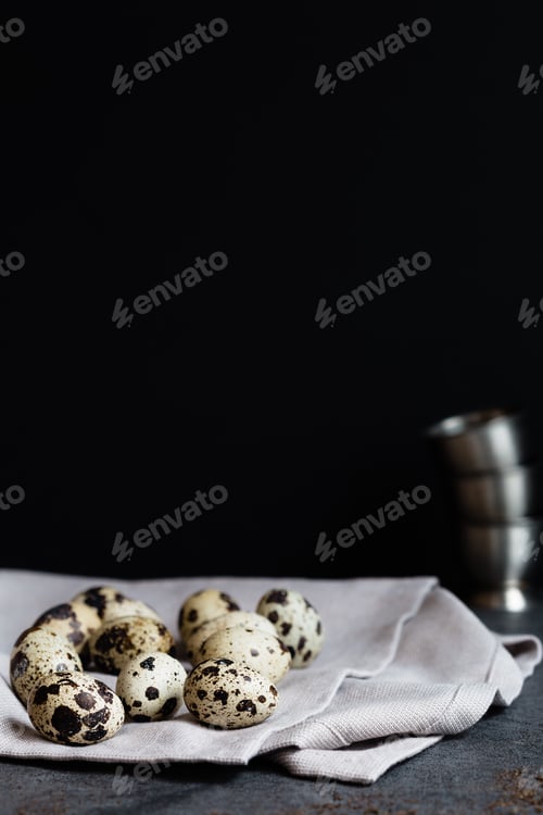 Preview: Quail Eggs on Napkin on Dark Slate Table