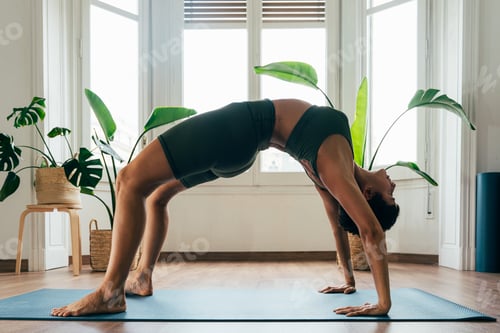 Preview: Beautiful sporty girl making yoga training