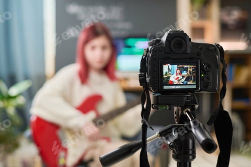 Preview: Girl with bass guitar on camera screen