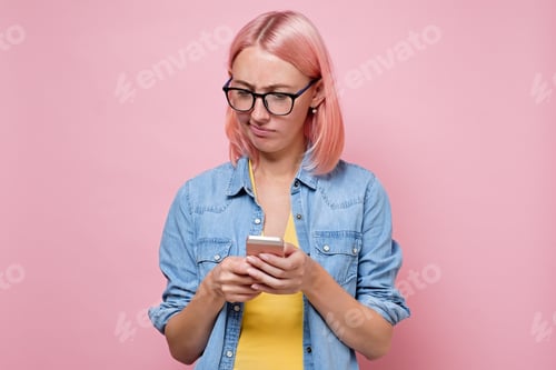 Preview: Woman with Pink Hair Looking at Phone