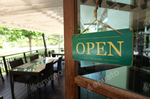 Preview: A welcoming open sign on a cafe, inviting customers to enjoy a delightful experience.