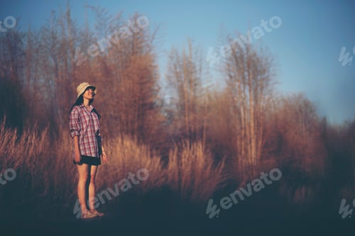 Preview: women standing alone with nature