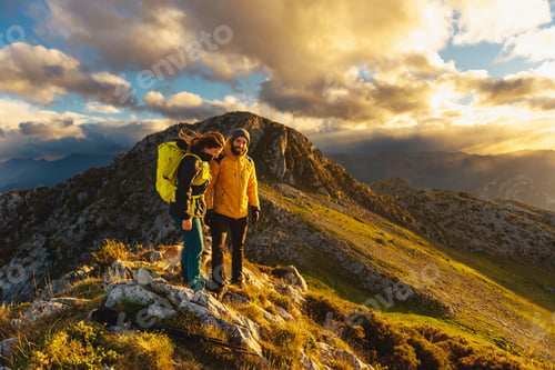 Preview: man and woman hiking in the mountains