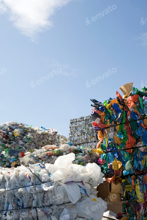 Preview: Stacks of recycling over blue sky