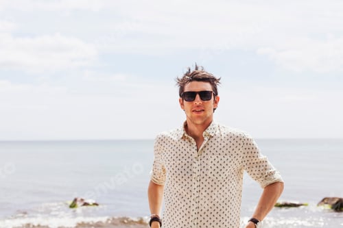 Preview: Close-up of man standing against sea