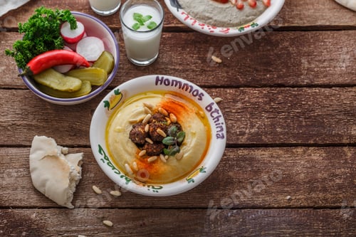 Preview: Arabian hummus with fresh salad and bread, coy space