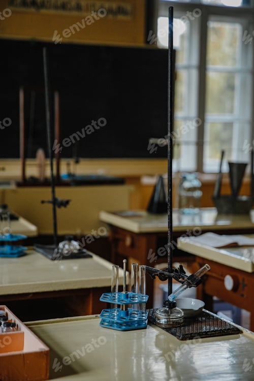 Preview: Vertical shot of an interior of an old empty chemistry class laboratory desk in a school