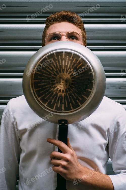 Preview: Chef cook covering face with pan