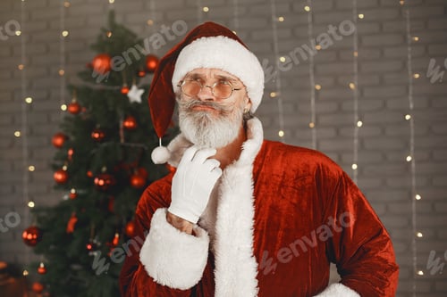 Preview: Man in santa claus costume looking at the camera