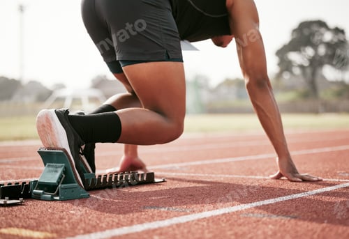 Preview: Rearview shot of an unrecognizable young male athlete starting his race on a track