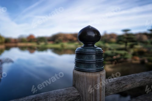 Preview: Walking bridge over lake with blurred out autumn colors
