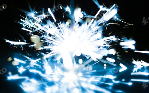 Preview: Close-up of blue sparkles of a burning fire