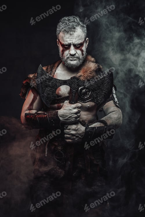 Preview: Savage warrior from the past with his axe in dark background