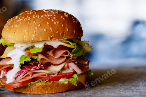 Preview: Big burger with ham tomato cheese lettuce ranch.