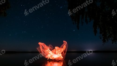 Preview: Beautiful light painting against the background of the starry sky.
