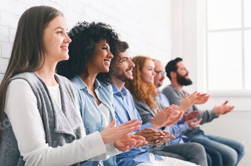 Preview: Happy People Sitting In Row Applauding To Mentor At Group Therapy