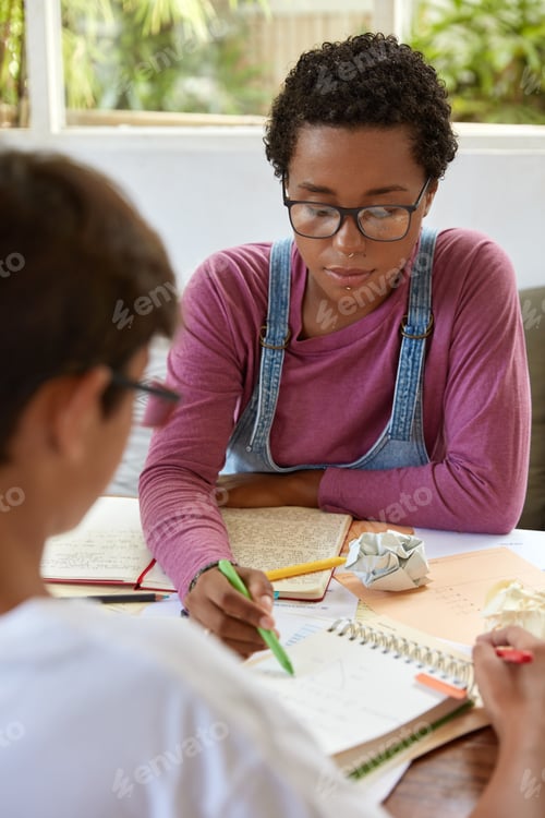 Preview: Beautiful stylish girl tries help younger brother who has problems with math, points at scheme in no