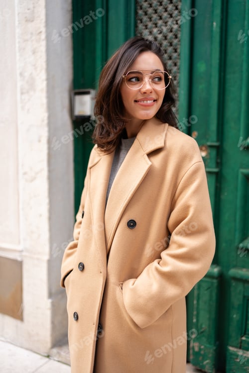 Preview: Friendly smiling attractive woman leaving building