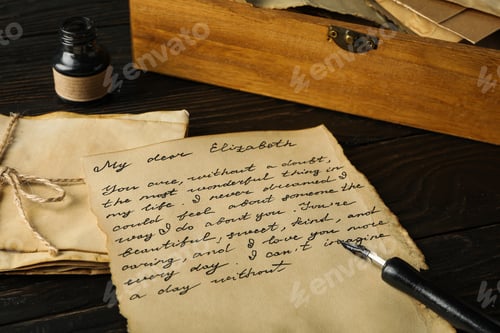 Preview: Old letter with text, pen and ink bottle on wooden background