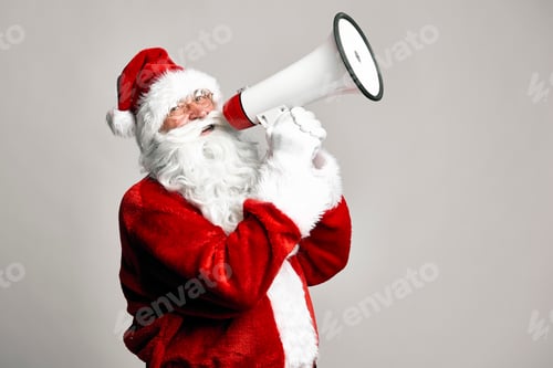 Preview: Caucasian Santa Claus talking by megaphone on grey background