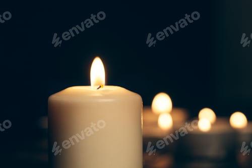 Preview: candles burning in darkness over black background. commemoration concept