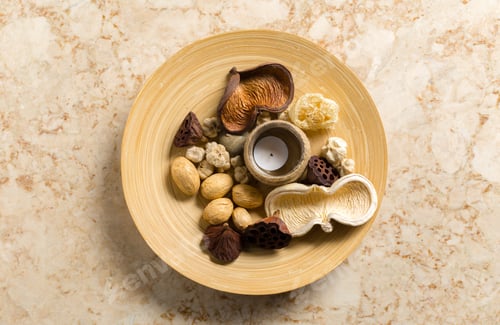 Preview: Collection of natural items arranged on a round plate in a simple display