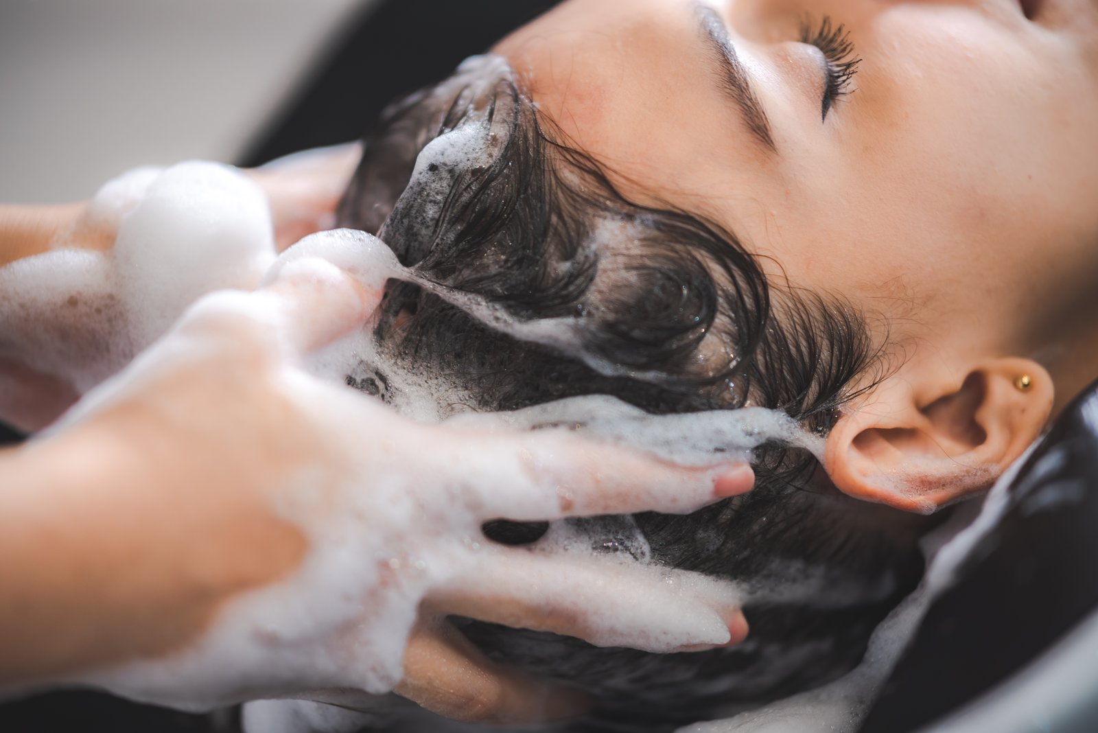 The smoothing process starts before styling, product selection at the wash stage sets the foundation