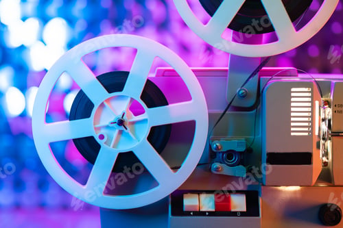 Preview: Retro reel with film rotating on colorful shining sparkles wall. Old-fashioned 8mm film projector