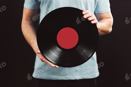 Preview: Man with vinyl record. Vintage music style. Male holding music old record. Retro music. Mockup