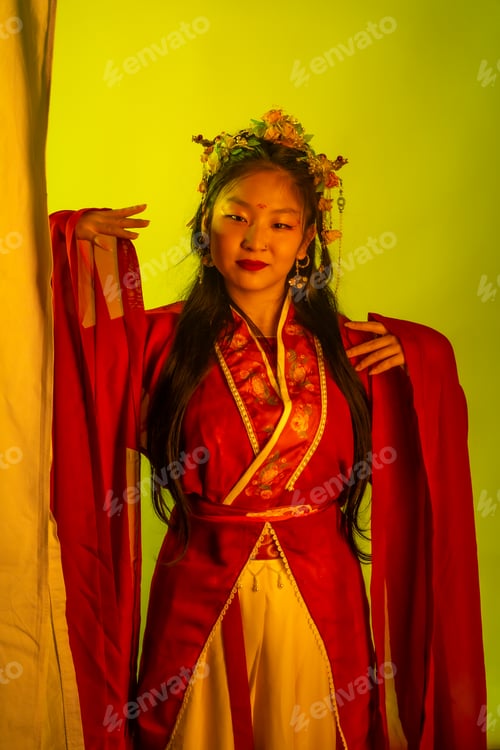 Preview: A woman in a red and white dress with a flower headpiece