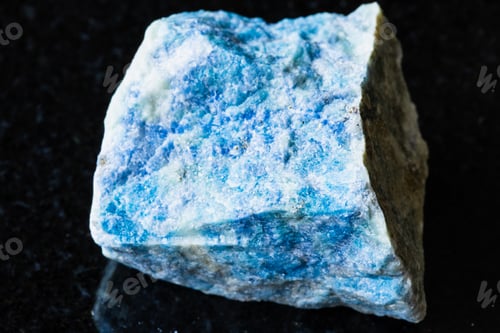 Preview: sample of raw lazurite mineral on black