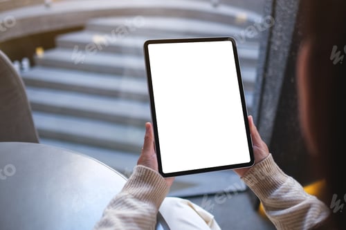 Preview: Mockup image of a woman holding digital tablet with blank white desktop screen in cafe