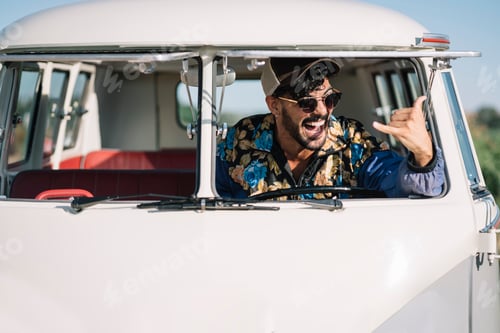 Preview: Man showing tongue and gesturing in van