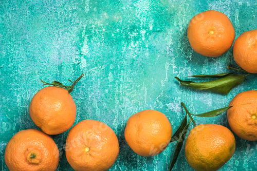 Preview: Fresh clementines over concrete slate background, food border