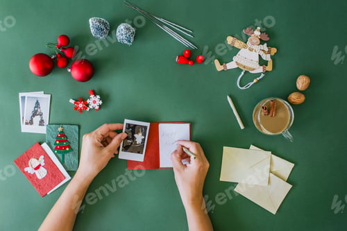 Preview: Woman's hands writing Christmas card