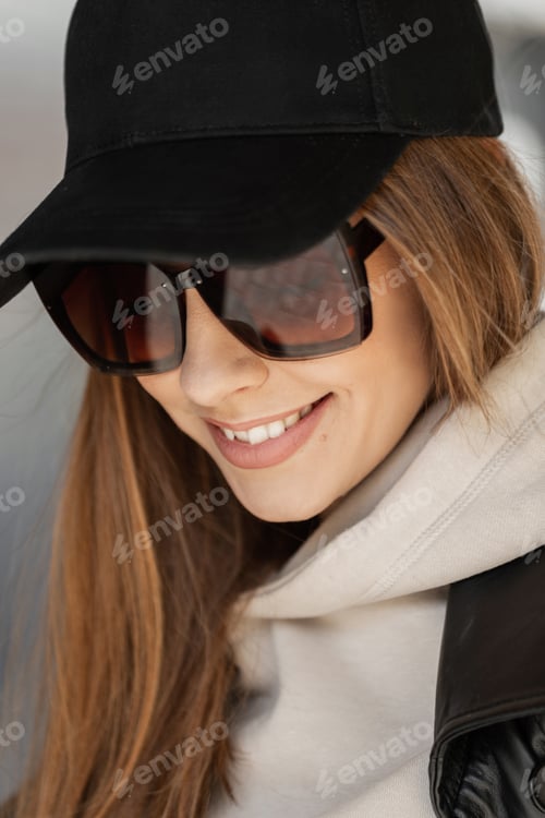 Preview: Stylish beautiful fresh woman in fashion clothes walking on a spring day