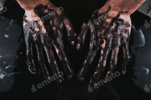 Preview: Men's hands in black paint, modern Art.