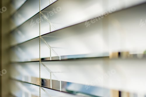 Preview: Sunlight coming through venetian blinds / shutters by the window