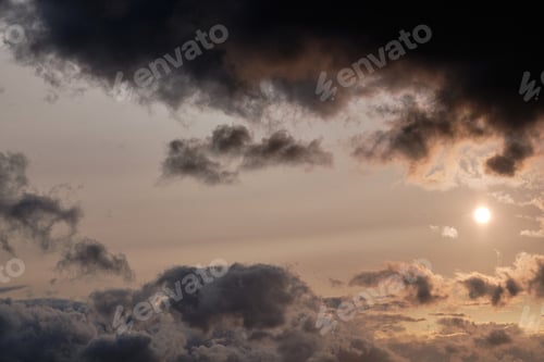Preview: Dark sky with clouds and sunlight