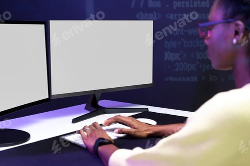 Preview: Female IT programmer working on blank screen computer