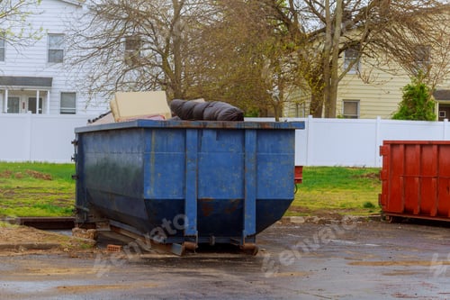 Preview: Residential view of new houses being built and construction garbage large container