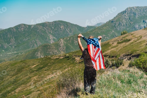 Preview: Man with child on his neck, boy on his back with an American flag