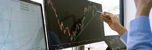 Preview: Stock Market Broker in formalwear Analyzing Graphs on screens in the office, investment concept