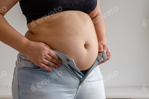 Preview: fat woman trying to zip up her jeans pants