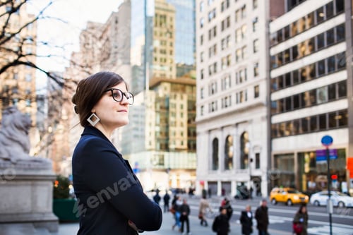 Preview: Side view of businesswoman waiting outside New York Public Library