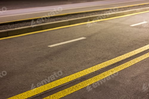 Preview: Wide bright double yellow marking sign line along modern wide smooth empty asphalt