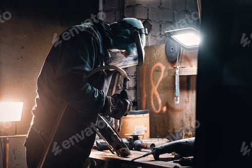 Preview: Busy man is working on metal factory