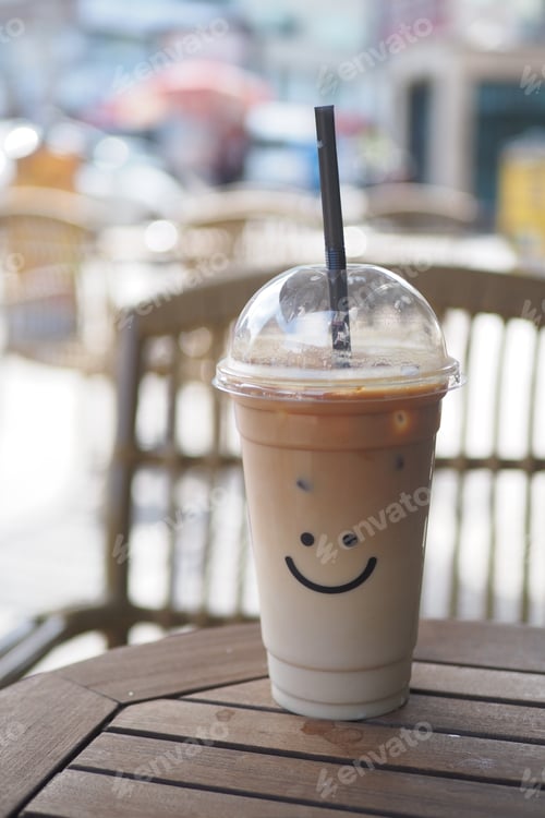 Preview: cold coffee in a plastic container with smile shape design on it