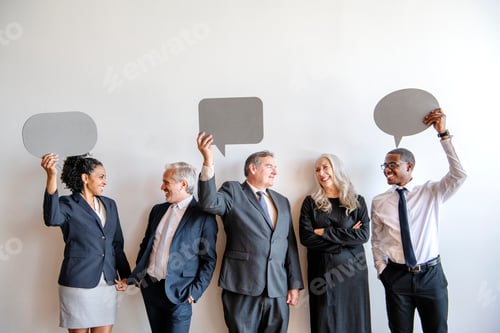Preview: Diverse business team holding speech bubbles