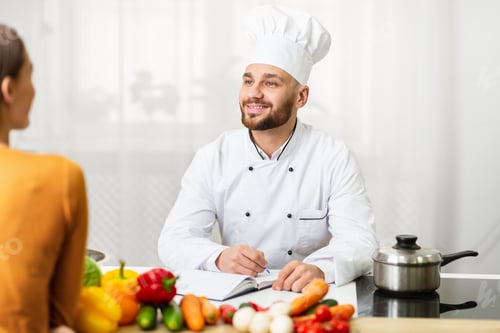 Preview: Professional Chef Man On Job Interview Talking With Woman In Kitchen